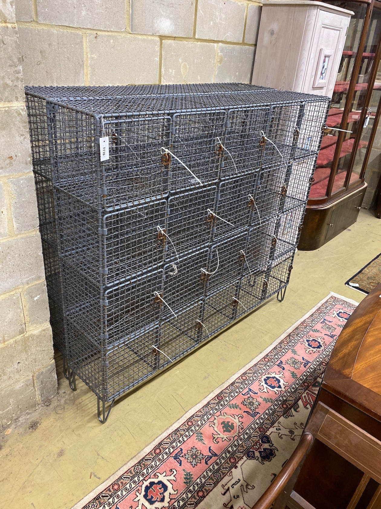 A pair of vintage wrought iron and wirework 20 door lockers, each width 153cm, depth 32cm, height 137cm